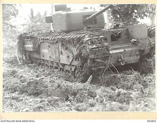 MADANG, NEW GUINEA. 1944-10. TANK TRACKS COVERED WITH ACCUMULATED MUD DURING TESTS CONDUCTED AT HQ 4 ARMOURED BRIGADE