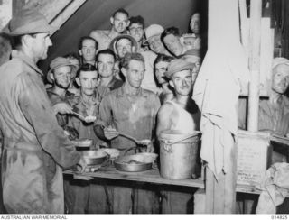 New Guinea. 1943-05-10. Meal time at a Civil Construction Corps Mess. Volunteers from the Corps were rushed from Australia to New Guinea to carry out urgent projects for the Allied Forces