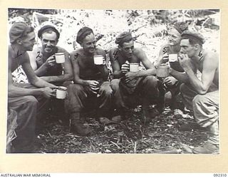 BOUGAINVILLE, 1945-05-18. PERSONNEL OF 57/60 INFANTRY BATTALION TAKING TIME OFF FOR A TEA BREAK DURING THE CONSTRUCTION OF WEAPON PITS. AFTER CROSSING THE HONGORAI RIVER THE BATTALION HAD ADVANCED ..
