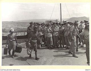 RABAUL, NEW BRITAIN. 1945-10-26. A GROUP OF AUSTRALIAN ARMY MEDICAL WOMEN'S SERVICE WHO HAVE JUST ARRIVED AT RABAUL TO STAFF 118 AUSTRALIAN GENERAL HOSPITAL. TWO SMALL JAPANESE SOLDIERS ARE ..