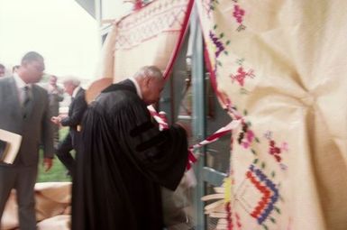 King Taufa'ahau Tupou IV, King of Tonga, entering church Vaine Mo'onia through a portal of fine mats