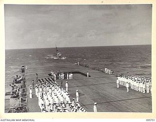 AT SEA OFF RABAUL, NEW BRITAIN. 1945-09-06. GENERAL H. IMAMURA, COMMANDER EIGHTH AREA ARMY, AND JAPANESE SURRENDER PARTY, ARRIVING ON THE FLIGHT DECK OF THE AIRCRAFT CARRIER HMS GLORY, ON THE ..