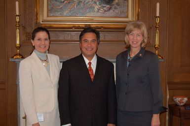 Secretary Gale Norton, far right, and Assistant Secretary for Policy, Management, and Budget, P. Lynn Scarlett, far left, with Governor of Guam, Felix Camacho, at Department of Interior headquarters