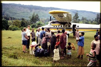 Viv Whitaker with crowd at airfield