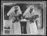 Nurses feeding infants