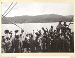 OFF BORAM BEACH, NEW GUINEA. 1945-10-13. THE FIRST BATCH OF TROOPS TO LEAVE THE WEWAK AREA UNDER THE PRIORITY DEMOBILISATION SCHEME WERE MEMBERS OF 6 DIVISION. SHOWN, TROOPS ALREADY EMBARKED ON ..