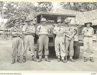 LAE, NEW GUINEA. 1944-08-22. PERSONNEL OF THE 12TH MOTOR TRANSPORT INSPECTION SECTION IN FRONT OF A LARGE ARMY TRUCK AT THE UNIT HEADQUARTERS. IDENTIFIED PERSONNEL ARE: V240192 CORPORAL E. BOOTHEY ..