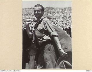 LAE, NEW GUINEA. 1945-06-09. LEADING AIRCRAFTMAN S.A. MILLER, RAAF, PACKED UP AND READY FOR TRANSPORT FROM 2/7 GENERAL HOSPITAL TO THE HOSPITAL SHIP MANUNDA