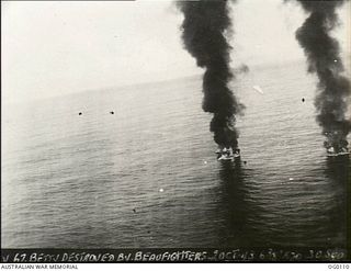 OFF NEW BRITAIN ISLAND, NEW GUINEA. 1943-06-09. PIECES OF A DESTROYED JAPANESE MITSUBISHI BOMBER AIRCRAFT, ALLIED CODE NAME "BETTY", WHICH WAS SHOT DOWN BY BEAUFIGHTER PILOT FLIGHT LIEUTENANT ..
