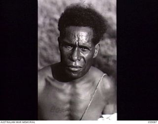 BUKAUA, NEW GUINEA. 1943-10-18. PORTRAIT OF POALU BORU A VOLUNTEER FOR THE AUSTRALIAN AND NEW GUINEA ADMINISTRATION UNIT LABOUR FORCE