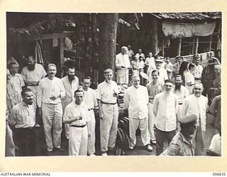 RAMALE MISSION, KOKOPO AREA, NEW BRITAIN. 1945-09-16. GROUP OF MISSIONARIES OF ALL NATIONALITIES AT RAMALE MISSION. THEY ARE MEMBERS OF A GROUP OF 158 WHITE INTERNEES WHO WERE LIBERATED WHEN TROOPS ..