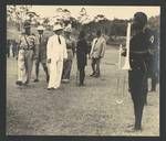 Colonel JK Murray inspecting Royal Papua and New Guinea Constabulary with Sandy Sinclair, John Grimshaw, and Edward Hallstrom, Hallstrom Livestock and Fauna Trust Station, Nondugl, Apr 1949