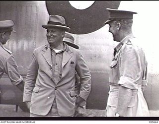 LAE AIRSTRIP, NEW GUINEA, 1946-01-27. MAJOR-GENERAL H. C. H. ROBERTSON, GENERAL OFFICER COMMANDING FIRST ARMY , GREETING THE HONOURABLE F. M. FORDE, MINISTER FOR THE ARMY, ON HIS ARRIVAL AT THE ..