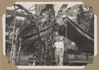 Alfred Amos in front of his tent and the brushing room, Lae, Papua New Guinea, 1945