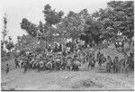 Church service in Kwiop: men and women dance on their way to Anglican church service