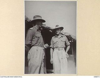 BORAM, NEW GUINEA. 1945-11-21. MAJOR W.R. MACKENZIE, COMMANDING OFFICER, 30 INFANTRY BATTALION, (1) WITH CAPTAIN S. URE-SMITH, ADJUTANT (2)