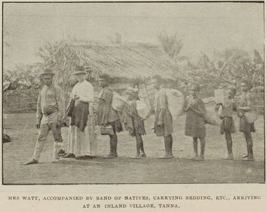 Mrs Watt, accompanied by band of natives, carrying bedding etc., arriving at an inland village, Tanna