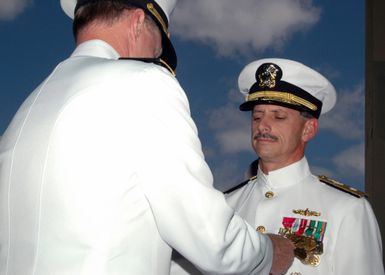 060808-N-4965F-016 (Aug. 8, 2006)US Navy (USN) Rear Adm. Michael C. Vitale (right), Commander, Theodore Roosevelt Strike Group, receives the Legion of Merit Medal from USN Adm. Gary Roughed, Commander, US Pacific Fleet, during his Change of Command (COC) ceremony on board Naval Station (NS) Pearl Harbor, Hawaii (HI).U.S. Navy official photo by Mass Communication SPECIALIST 1ST Class James E. Foehl (RELEASED)