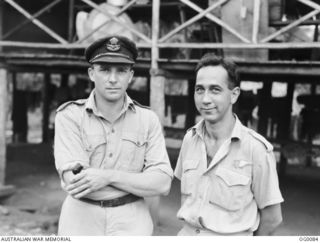 PORT MORESBY, PAPUA. C. 1943-07. WING COMMANDER CLARRIE GLASSCOCK (LEFT) OF ABBOTTSFORD POINT, SQUADRON CO, AND FLYING OFFICER NED KELLEY OF NEWCASTLE, NSW, OF NO. 30 (BEAUFIGHTER) SQUADRON RAAF. ..