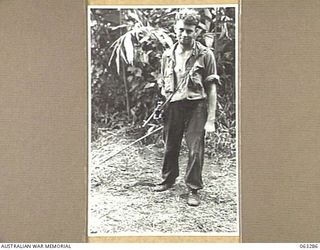 FAITA AREA, NEW GUINEA. 1944-01-07. NX49475 TROOPER J. KEENAHAN OF CABRAMATTA, VIC, AND OF THE 2/2ND COMMANDO SQUADRON RETURNING FROM AN 8 DAY PATROL THROUGH JAPANESE HELD TERRITORY NEAR BOGADJIM