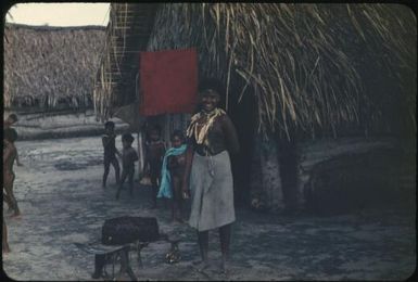 A woman and five children standing outside a village house : Tasman Islands, Papua New Guinea, 1960 / Terence and Margaret Spencer