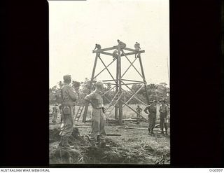 AITAPE, NORTH EAST NEW GUINEA. 1944-04-24. ENGINEERS OF NO. 62 WORKS WING RAAF PUTTING UP A DUTY PILOT'S TOWER ON THE RAAF BUILT AIRSTRIP AT TADJI, FROM WHICH AN ALLIED FIGHTER UMBRELLA OPERATED ..