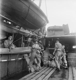 NEW BRITAIN. 1945-05-01. TROOPS OF 37/52 INFANTRY BATTALION WERE FERRIED BY BARGE FROM THE AK82, TO WIDE BAY; OPEN BAY ON THE NORTH COAST IS THEIR DESTINATION