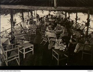 Lae, New Guinea. 1944-08-02. The open-sided verandah lounge where staff of 2/7th Australian General Hospital relax
