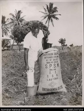 Farmer spreading Ammonium Sulphate