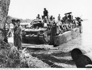 Finschhafen Area, New Guinea. 1943-09. Matilda tanks arriving to give support to the 2nd AIF in its attack on Finschhafen