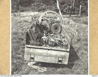 PORT MORESBY, NEW GUINEA. 1943-11-15. A NORMAL 25-POUNDER GUN OF THE 2/5TH AUSTRALIAN FIELD REGIMENT WHICH HAS BEEN STRIPPED TO ITS COMPONENTS IS SHOWN PACKED INTO A THREE TON TRUCK. THIS ..