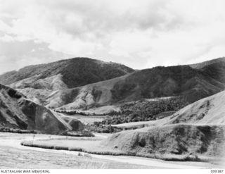 WAU-LABU ROAD, NEW GUINEA, 1945-12-13. VIEW FROM THE ROAD NEAR THE JUNCTION OF THE SNAKE AND WATUT RIVERS