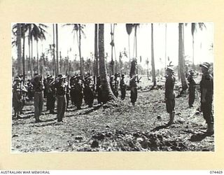 MADANG, NEW GUINEA. 1944-07-02. VX24325 BRIGADIER H.H. HAMMER, DSO, COMMANDING, 15TH INFANTRY BRIGADE (1) TAKES THE SALUTE ON HIS ARRIVAL FOR HIS INSPECTION OF PERSONNEL OF THE 24TH INFANTRY ..