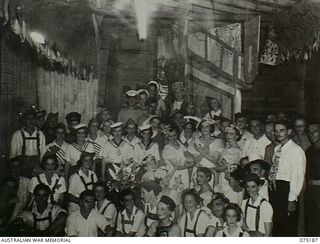 Lae, New Guinea. 11 August 1944. Informal group portrait of members of the White Horse Inn concert party on stage. The concert party was made up of members of 2/7 Australian General Hospital (AGH), ..