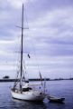 French Polynesia, 'Nomad' sailboat anchored off shore of Tahiti Island