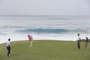 Barack Obama plays golf with Prime Minister Najib Razak, Joe Paulsen, and Mike Brush in Kaneohe Bay, Hawaii, December 24, 2014