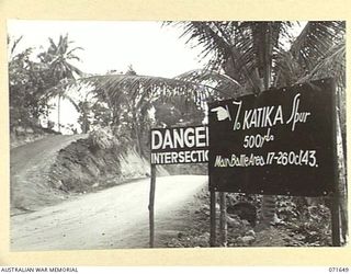 FINSCHHAFEN, NEW GUINEA. 1944-03-27. THE KATIKA BATTLE SIGN POSITIONED SOME 500 YARDS FROM THE KATIKA SPUR INDICATING THE SCENE OF THE MAIN BATTLE AREA