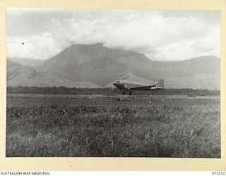 DUMPU, NEW GUINEA. 1944-05-19. NO. 1 AIRCRAFT, A DOUGLAS C47 TRANSPORT AIRCRAFT OF THE UNITED STATES ARMY AIR FORCE, TAKING OFF FOR WAU WITH MEMBERS OF THE 11TH DIVISION. THE 11TH DIVISION, WHICH ..