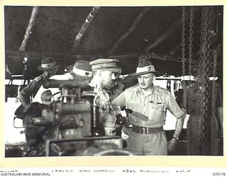 AITAPE, NEW GUINEA. 1945-02-18. MAJOR- GENERAL E.B. ROWCROFT, DIRECTOR OF MECHANICAL ENGINEERING, BRITISH ARMY (3) CHATTING WITH QX4272 LIEUTENANT F.G.H. DICKINS, OFFICER- IN- CHARGE, 2/119TH ..