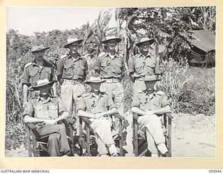 CAPE WOM, WEWAK POINT, NEW GUINEA. 1945-08-30. OFFICERS OF BRIGADE HEADQUARTERS AND HEADQUARTERS COMPANY, 2/3 MACHINE-GUN BATTALION WITH LIEUTENANT COLONEL R.R. GORDON, COMMANDING OFFICER (2)