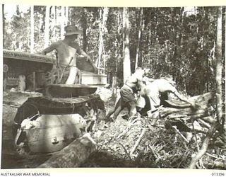 1942-10-09. WITH THE QUICKENING TEMPO OF THE WAR IN NEW GUINEA, AUSTRALIAN ARMY ENGINEERS ARE PUSHING AHEAD WITH ROAD CONSTRUCTION TO FACILITATE THE MOVEMENT OF TROOPS THROUGH THE JUNGLE TO FORWARD ..