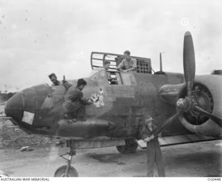 VIVIGANI, GOODENOUGH ISLAND, PAPUA. C. 1943-12. "SHE'S APPLES" IS THE QUAINT NAME OF A BOSTON LIGHT BOMBER AIRCRAFT WHICH IS THE PRIDE OF NO. 22 (BOSTON) SQUADRON RAAF. THE GROUND CREW IS GOING ..