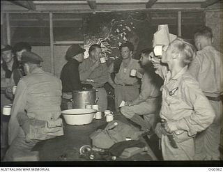 VIVIGANI, GOODENOUGH ISLAND, PAPUA. 1944-01-11. A CUP OF TEA IS THE AUSTRALIAN HABIT EVEN FOR THE CREW OF THE BEAUFORT BOMBER SQUADRONS OF THE RAAF AFTER AN AIR ATTACK ON RABAUL