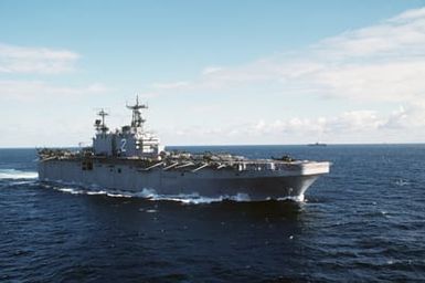 A starboard bow view of the amphibious assault ship USS SAIPAN (LHA 2) underway during NATO Exercise NORTHERN WEDDING 86