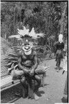 Pig festival, singsing, Kwiop: man with feather headdress and nose ornaments, kina shell valuables, kundu drum