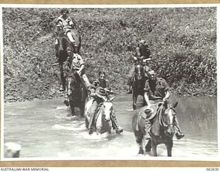 NEW GUINEA. 1944-01-02. AUSTRALIAN TROOPS AND MEMBERS OF THE AUSTRALIAN WOMEN'S ARMY SERVICE ENJOYING A HORSEBACK RIDE DURING THEIR REST DAY. THEY ARE: VX120838 CORPORAL J. HUSTON (1); VX85158 ..