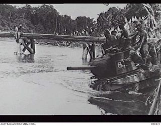 BOUGAINVILLE, 1945-04-04. A MATILDA TANK FROM 8 TROOP, B SQUADRON, 2/4TH ARMOURED REGIMENT ENTERING THE PURIATA RIVER AFTER IT HAD BEEN WATERPROOFED BY THE CREW. THE TROOP MOVED UP FROM TOKO ALONG ..