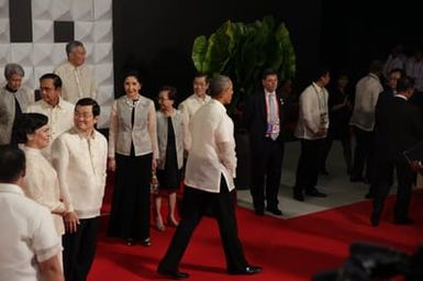 Barack Obama joins Asia Pacific Economic Cooperation Summit leaders and spouses for a group photo in Pasay, Metro Manila, Philippines, November 18, 2015