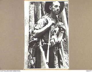 GUY'S POST, FARIA RIVER AREA, NEW GUINEA. 1943-11-08. NX38392 PRIVATE R. S. LOVELL OF WOY WOY, NSW, AND OF THE 2/33RD AUSTRALIAN INFANTRY BATTALION MOVING GO GUY'S POST TO RELIEVE MEMBERS OF THE ..