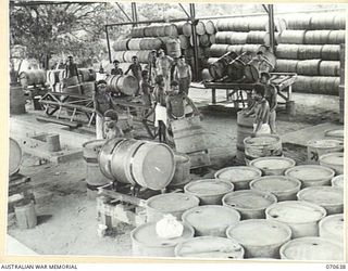 PORT MORESBY, PAPUA, 1944-02-26. THE DRUM RUMBLING PLANT WHICH IS A SECTION OF THE BULK OIL INSTALLATIONS, 1ST PETROLEUM STORAGE COMPANY